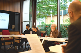One boy and one girl talking with laptop in front of them depicting the online education available at Trinity College Theological School
