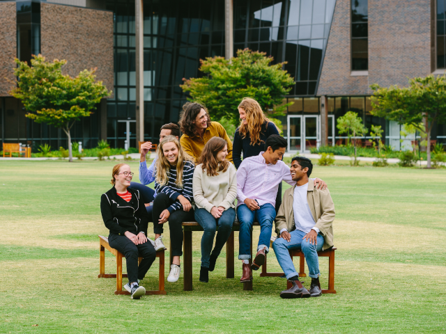 A candid group picture of the scholarship students at Trinity residential college posing at the Bulpadock lawn.