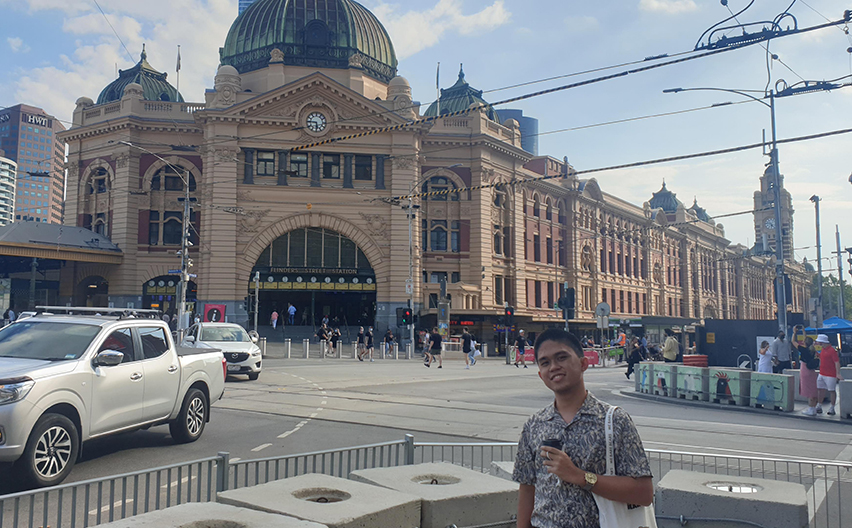 Jude outside Flinders St Station in Melbourne