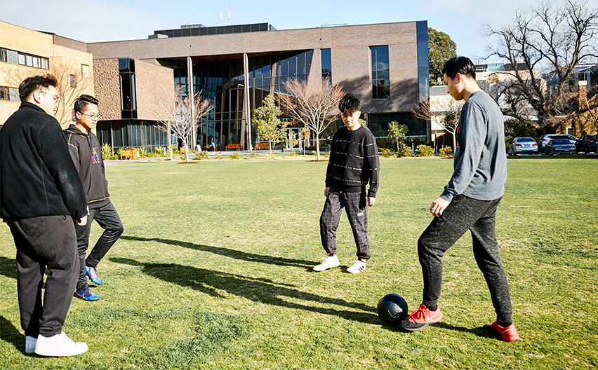 Trinity College Foundation Studies students playing soccer