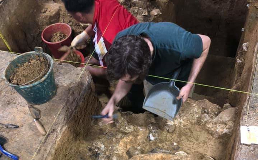 Jarrad with his head down, digging in a deep pit