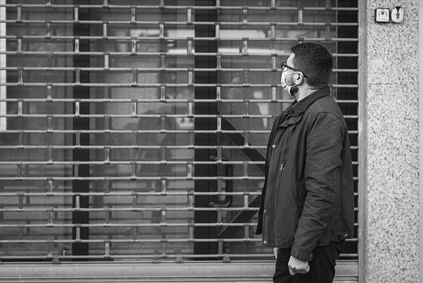 Man in front of closed store