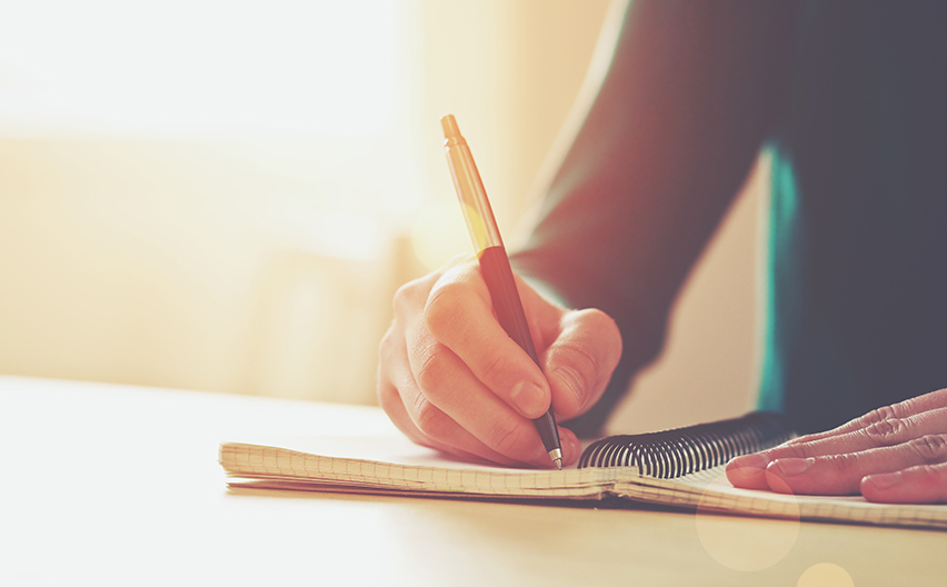 Girl writing in journal