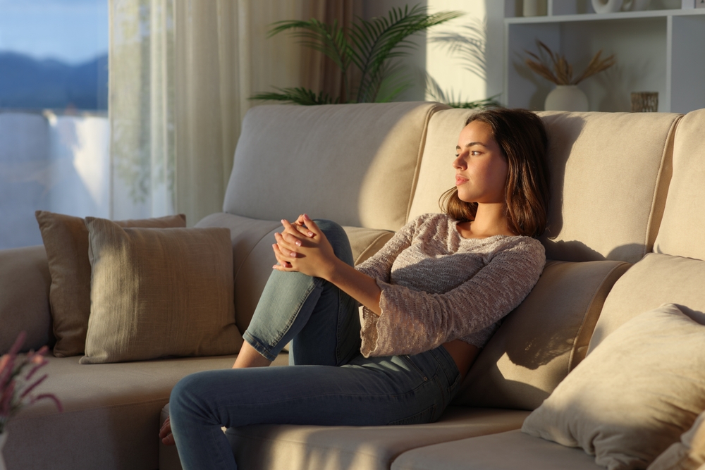 woman alone on couch