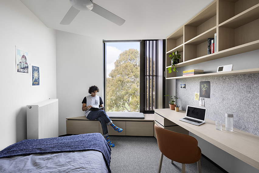 One boy sitting in his room at the residential college, Trinity College